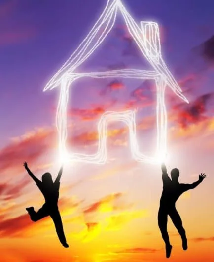 A couple and a house under a Spanish Sunset